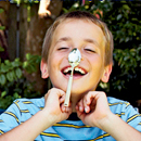 Photo: Boy with a spoon on his nose