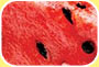 Photograph shows a section of watermelon