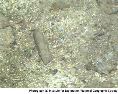 image: possibly an ax or chisel